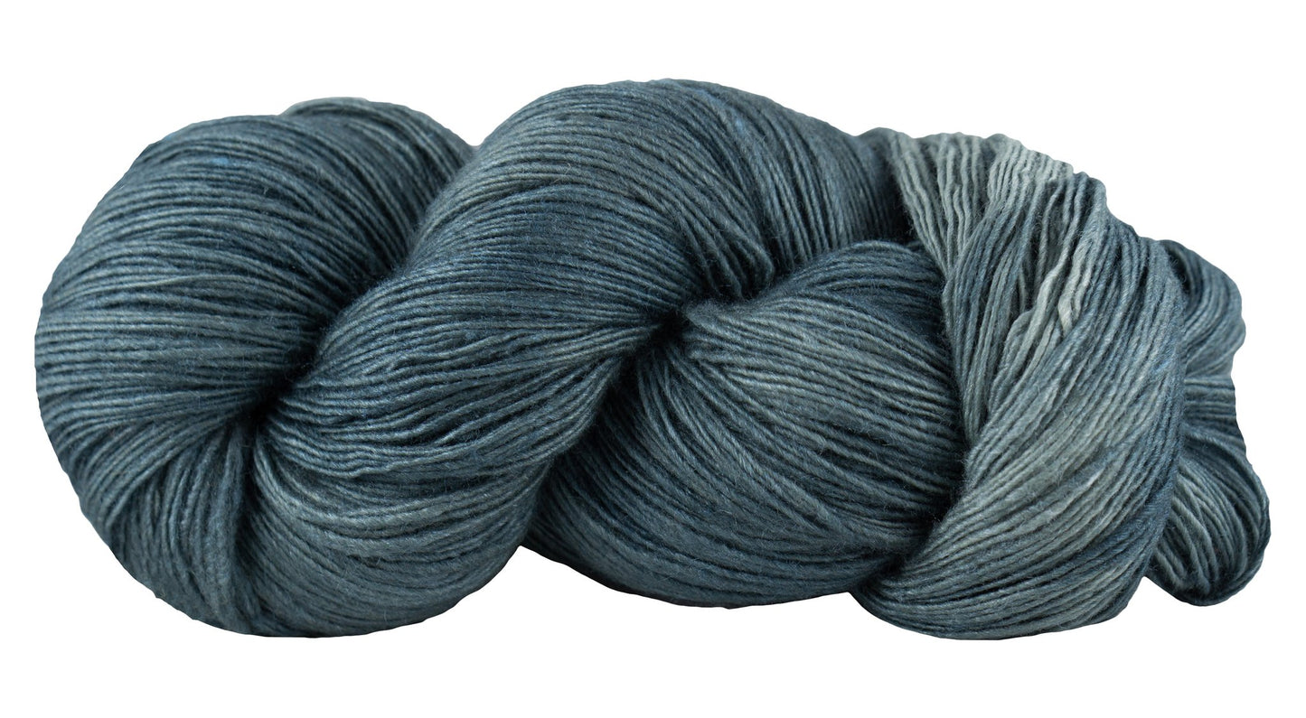 Hand-dyed fingering weight merino and silk wool yarn - Manos del Uruguay in dark denim.